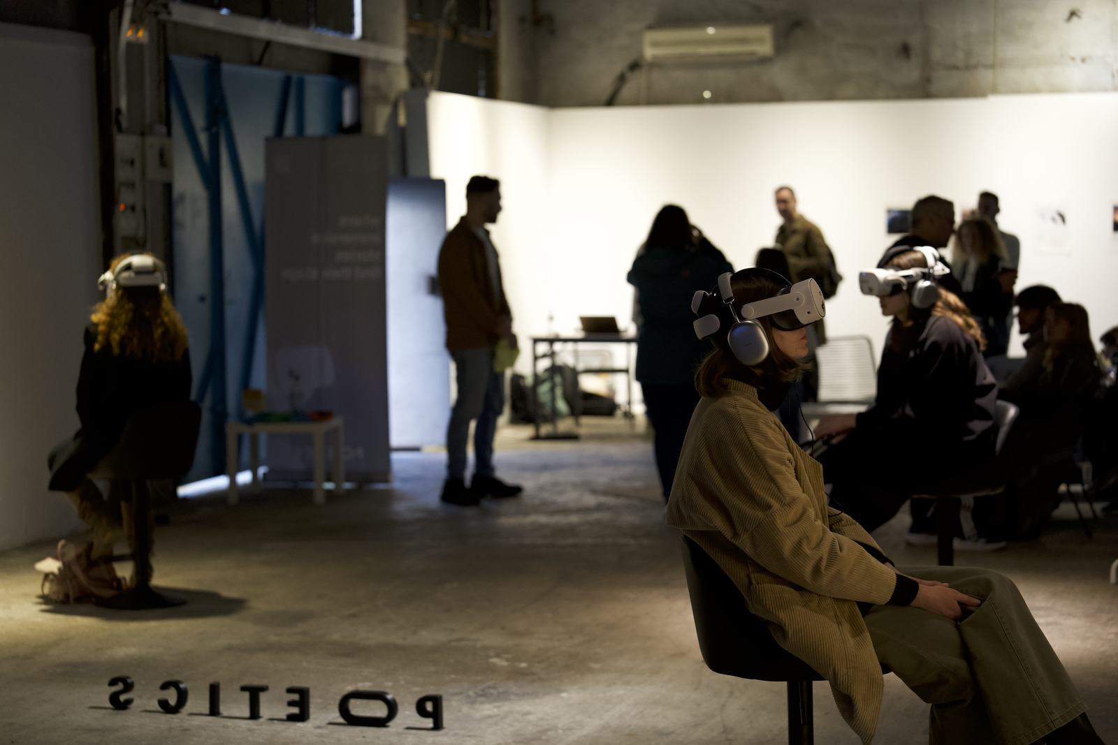 Visitor wearing a Poetics VR headset with soft green foreground light