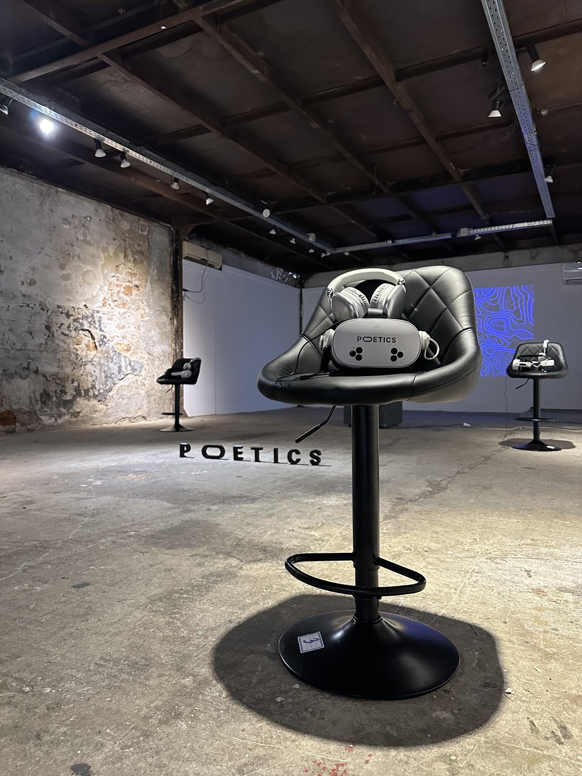 Poetics VR station in an industrial gallery setting