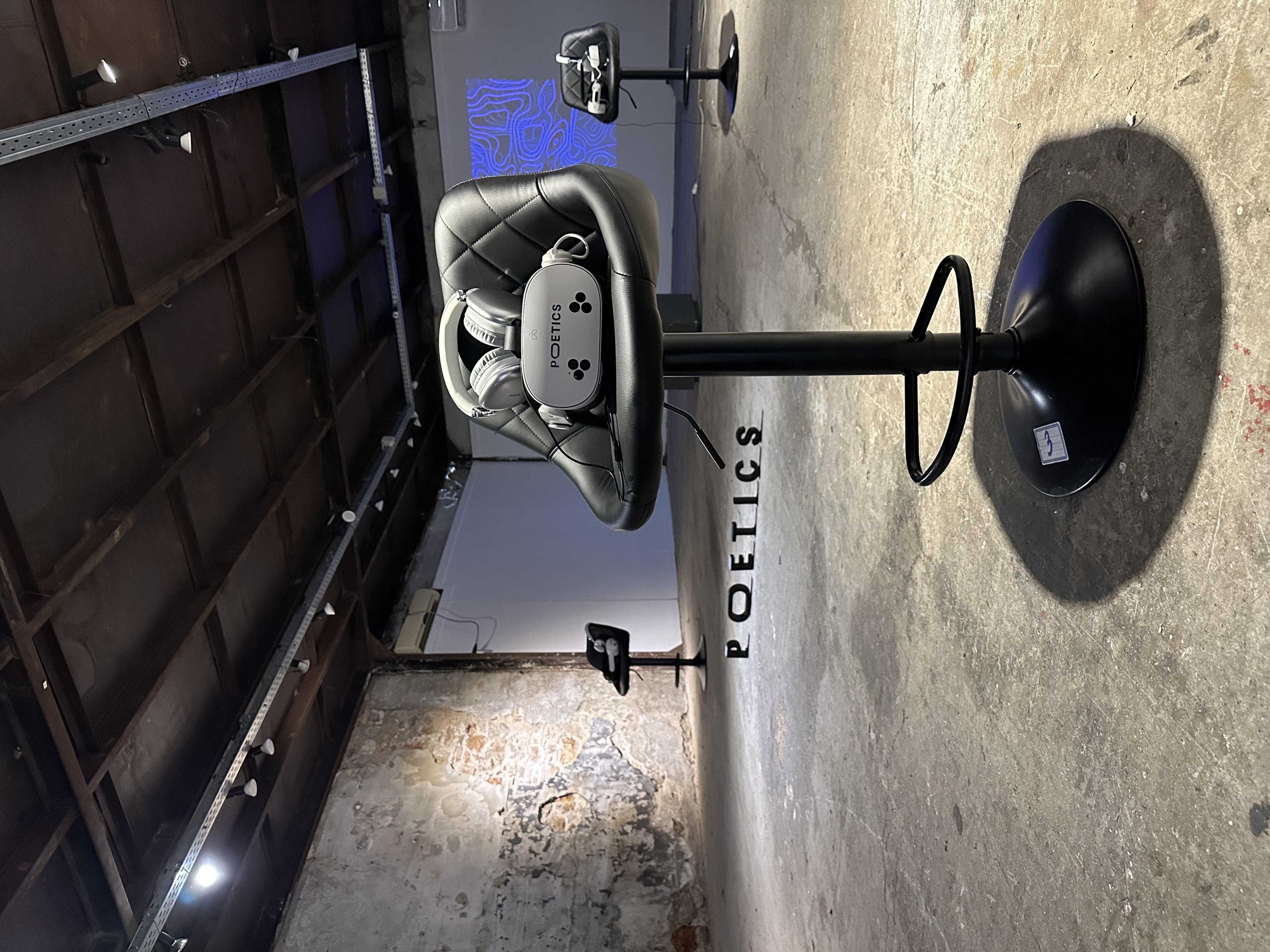 Poetics VR station in an industrial gallery setting