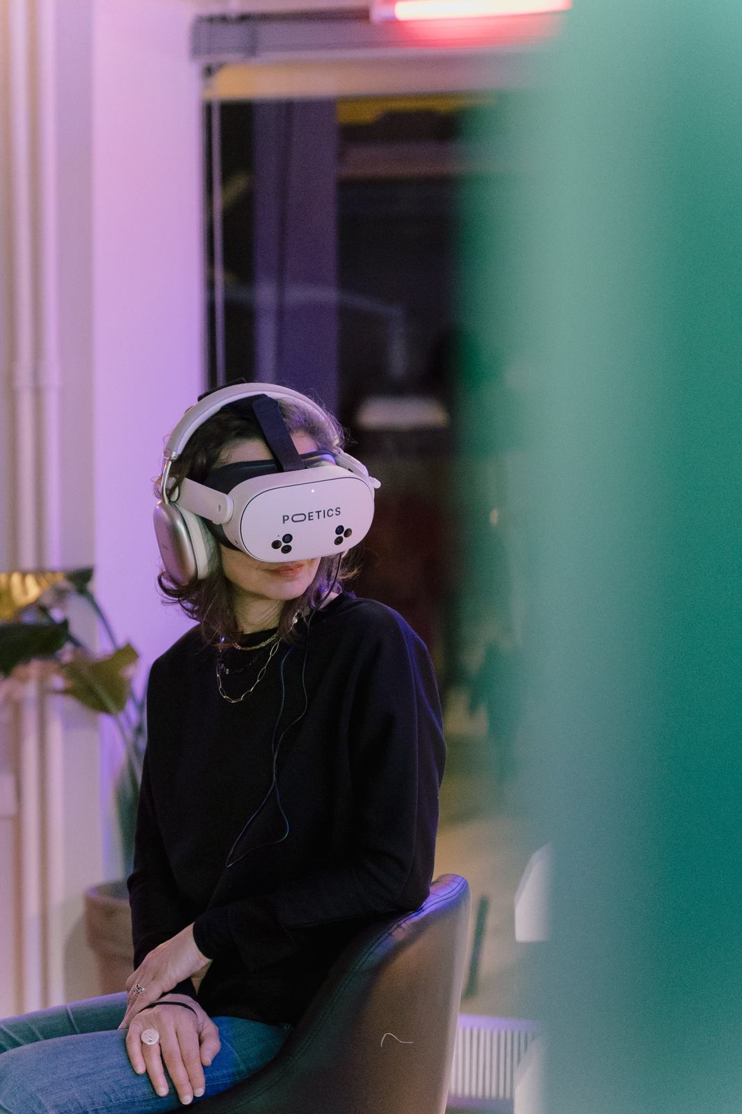 Visitor wearing a Poetics headset in a gallery venue